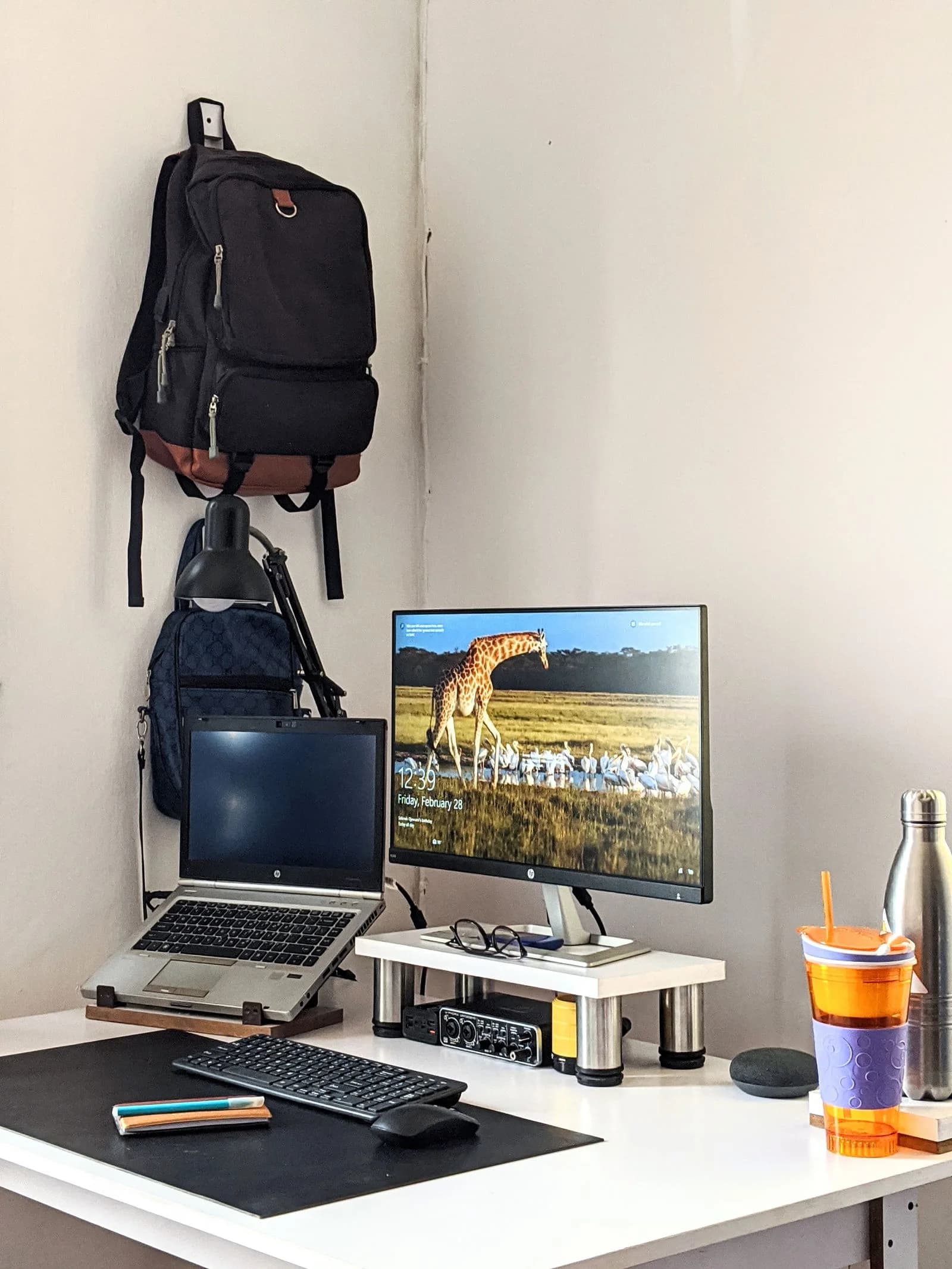 Laptop and desktop computer in a naturally lit working environment